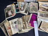 a lot of old photos on the table together