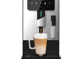 a coffee machine with a cup of coffee on top of it