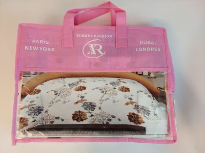 a pink bag with a picture of a bed in it