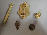 several pieces of metal are laying on top of a white surface