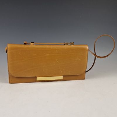 tan leather clutch bag with gold metal clasp