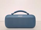 the bose bluetooth portable speaker sits on a white surface