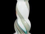 a glass vase with a spiral design on it