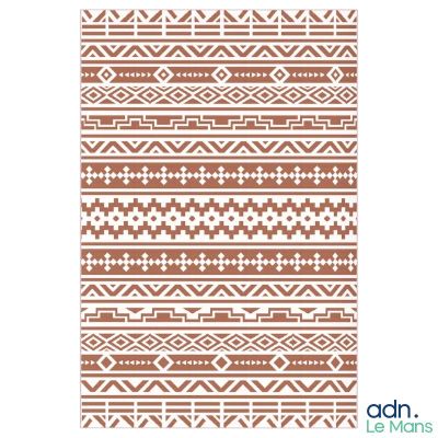 a brown and white rug with a pattern on it