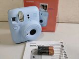fuji instax mini camera with batteries and instruction booklet