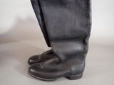 a close up of a pair of boots on a white surface