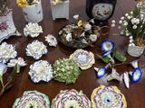 many different types of flowers in vases on the table