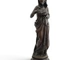 an old statue of a woman holding a baby in her arms