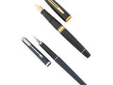 a close up of a pen and a ballpoint pen on a white background