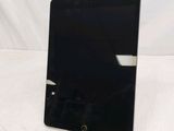 an image of a black tablet computer sitting on top of a table