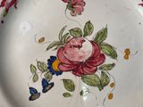 a white plate with a floral design on it