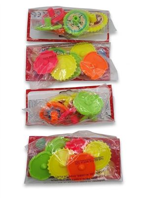 three bags of assorted plastic toys are lined up on a white surface