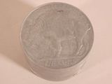 a silver coin sitting on top of a white table