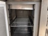 an open refrigerator that is sitting in a kitchen