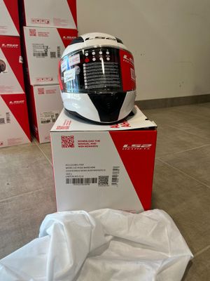 a helmet sitting on top of a box on the floor