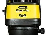 a close up of a yellow and black laser level on a tripod