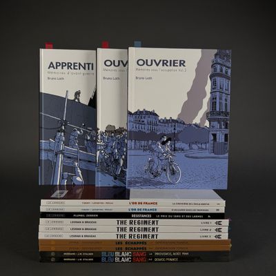 several books are stacked on top of each other on a table