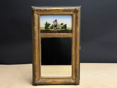 un vieux cadre contenant un tableau représentant un homme et une femme
