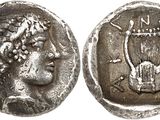 a silver coin with an image of a woman on it