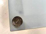 a glass table with a coin on top of it