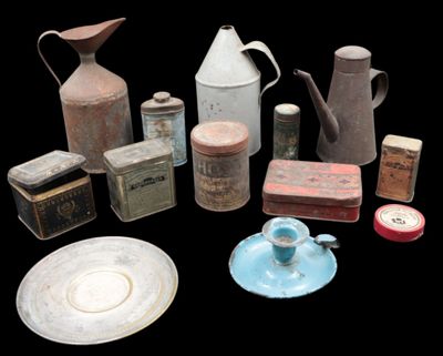 many different types of tins and containers on the table