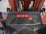 a close up of a forklift with a red sticker on it