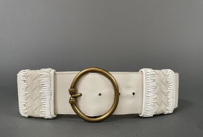 a white leather belt with a gold buckle and braiding