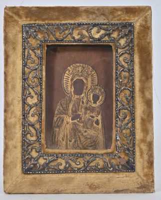 an old picture of a woman holding a child in a gold frame