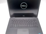 the dell laptop is open and ready to be used