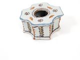 a small white box with a blue and yellow design on it