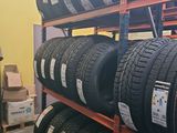 a lot of tires on the shelves in the store