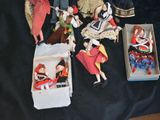 a lot of dolls that are sitting on a table