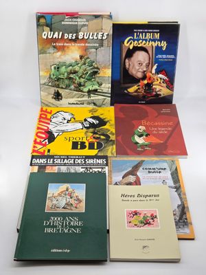 plusieurs livres sont empilés sur une surface blanche