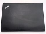 a black laptop that is sitting on a white table