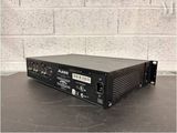 an image of a black amplifier sitting on top of a table