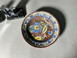 a small bowl with a decorative design on it
