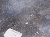 a close up of a piece of metal with a sticker on it