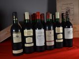 several bottles of wine are lined up on a table