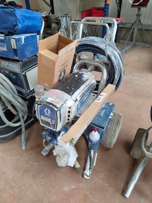 a machine that is sitting on a cart in a garage