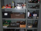 a cupboard with many items in it in a room