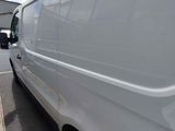 a white van parked on the side of the road