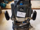 a picture of a drill on a table in a workshop
