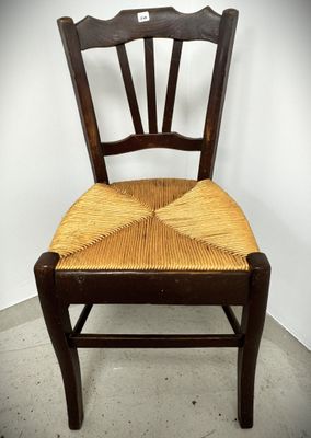 an image of a wooden chair with a wicker seat