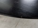 a close up of a table with a black top
