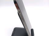 a close up of a cell phone on a stand