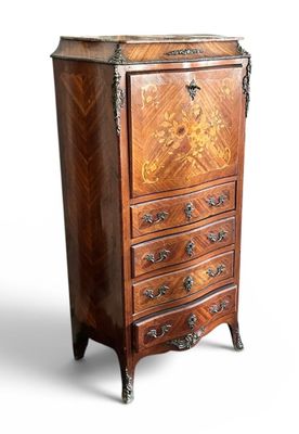 an old wooden chest of drawers with ornate carvings on it