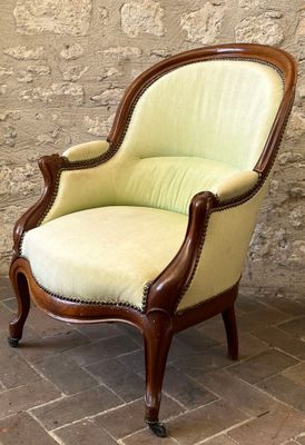 an image of a green chair sitting on top of a brick floor