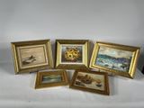 five framed pictures of boats and sunflowers on a table