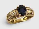 une image représentant une bague en or sertie d'un saphir entouré de diamants