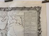 an old map on the wall of a room